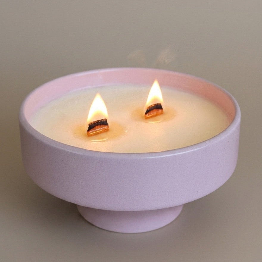 PRESENTE Taller Artesanal pastel pink ceramic double wick candle with pedestal base and wood wicks.